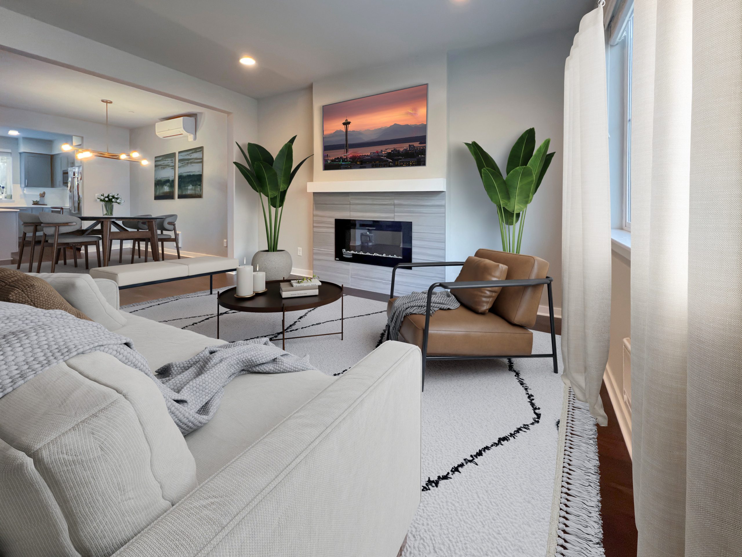 Seattle condo virtually staged with a sectional sofa, accent chair, plants, and coordinated dining furniture