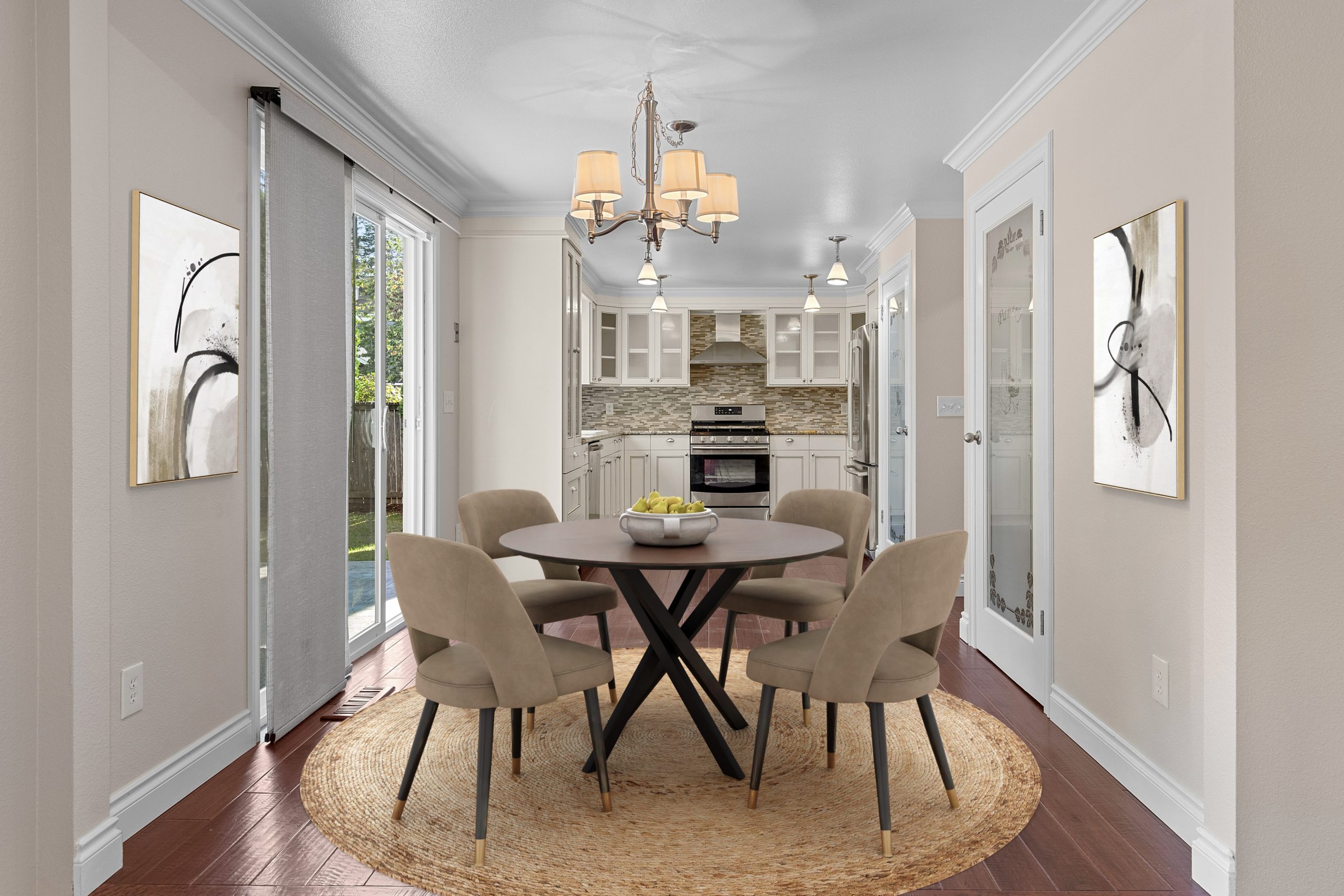 Dining room with a round table, upholstered chairs, and built-in cabinetry