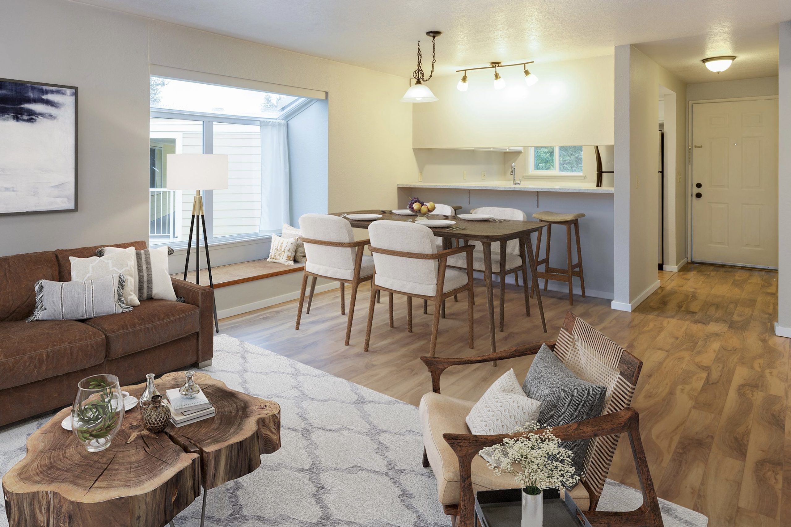 Furnished living and dining space with warm wood floors and contemporary furniture